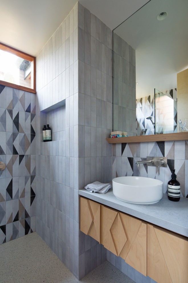 This is an example of a small contemporary bathroom in Sydney with engineered stone worktops and a floating vanity unit.
