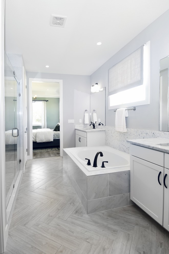Bathroom - master white tile gray floor bathroom idea in Jacksonville with black cabinets, white walls and white countertops