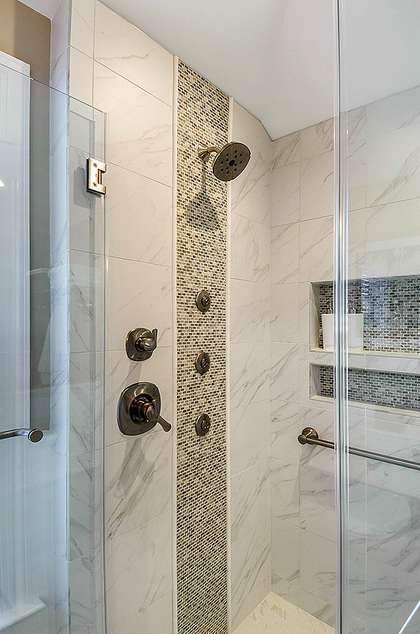 Inspiration for a contemporary master white tile and porcelain tile porcelain tile and white floor bathroom remodel in Philadelphia with recessed-panel cabinets, medium tone wood cabinets, a two-piece toilet, beige walls, an undermount sink, quartz countertops, a hinged shower door and white countertops