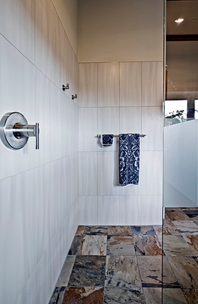 Example of a mid-sized trendy master gray tile and porcelain tile slate floor bathroom design in Seattle with an undermount sink, flat-panel cabinets, medium tone wood cabinets, quartz countertops, a one-piece toilet and white walls