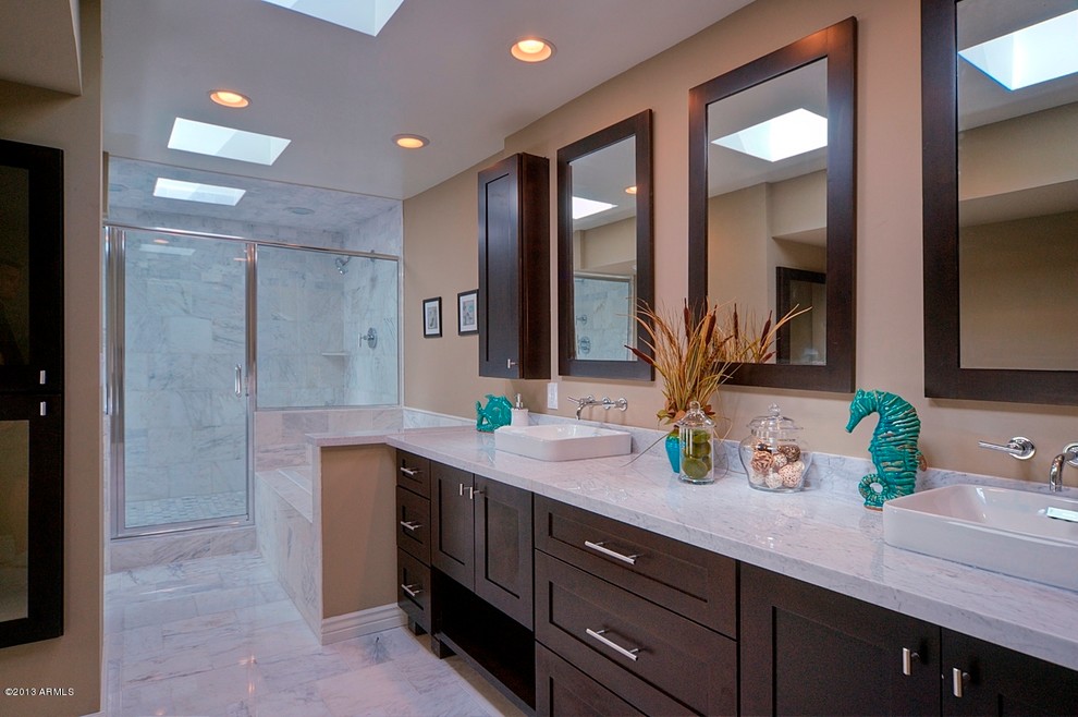 Bathroom - mid-sized transitional white tile and stone tile marble floor bathroom idea in Phoenix with a vessel sink, shaker cabinets, dark wood cabinets, marble countertops and beige walls