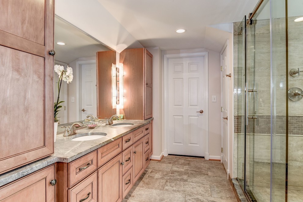 Photo of a medium sized contemporary ensuite bathroom in DC Metro with recessed-panel cabinets, medium wood cabinets, beige walls, travertine flooring, a submerged sink, soapstone worktops, multi-coloured floors, a sliding door and green worktops.