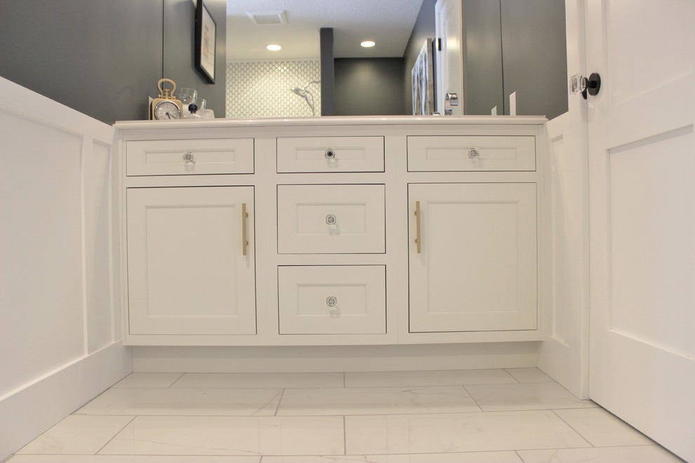 Example of a mid-sized transitional master white tile and ceramic tile marble floor and white floor bathroom design in Other with flat-panel cabinets, white cabinets, gray walls, an undermount sink and quartz countertops