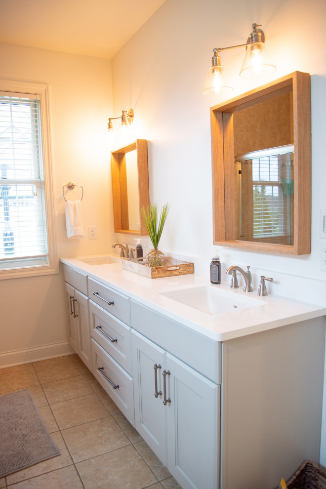 Photo of a large nautical ensuite bathroom in Other with recessed-panel cabinets, green cabinets, white walls, ceramic flooring, an integrated sink, engineered stone worktops, beige floors, white worktops, double sinks and a built in vanity unit.