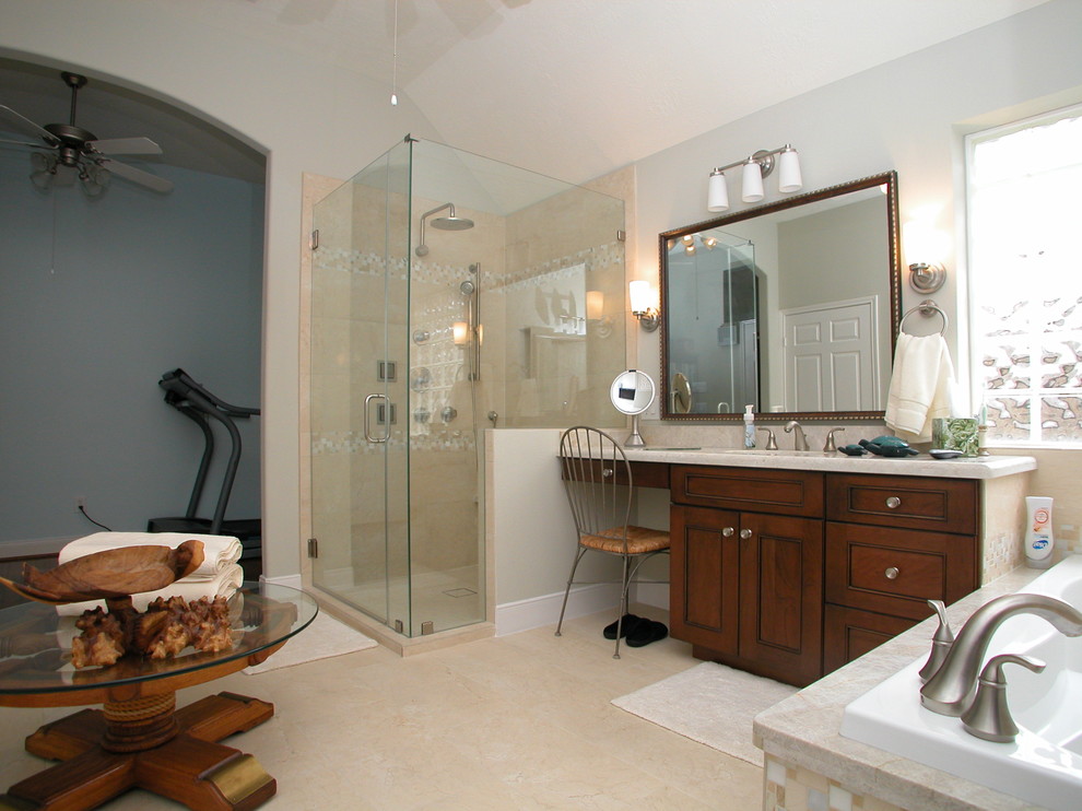 Exemple d'une grande salle de bain principale chic en bois foncé avec un lavabo encastré, un placard avec porte à panneau encastré, un plan de toilette en quartz, une baignoire posée, une douche d'angle, un carrelage beige, des carreaux de porcelaine, un mur gris et un sol en carrelage de porcelaine.