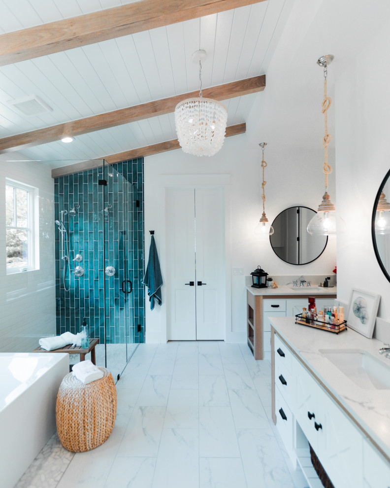 Inspiration for a large nautical ensuite bathroom with white cabinets, a corner bath, a double shower, a two-piece toilet, blue tiles, ceramic tiles, white walls, ceramic flooring, marble worktops, multi-coloured floors, a hinged door, white worktops, an enclosed toilet, double sinks, a built in vanity unit and exposed beams.