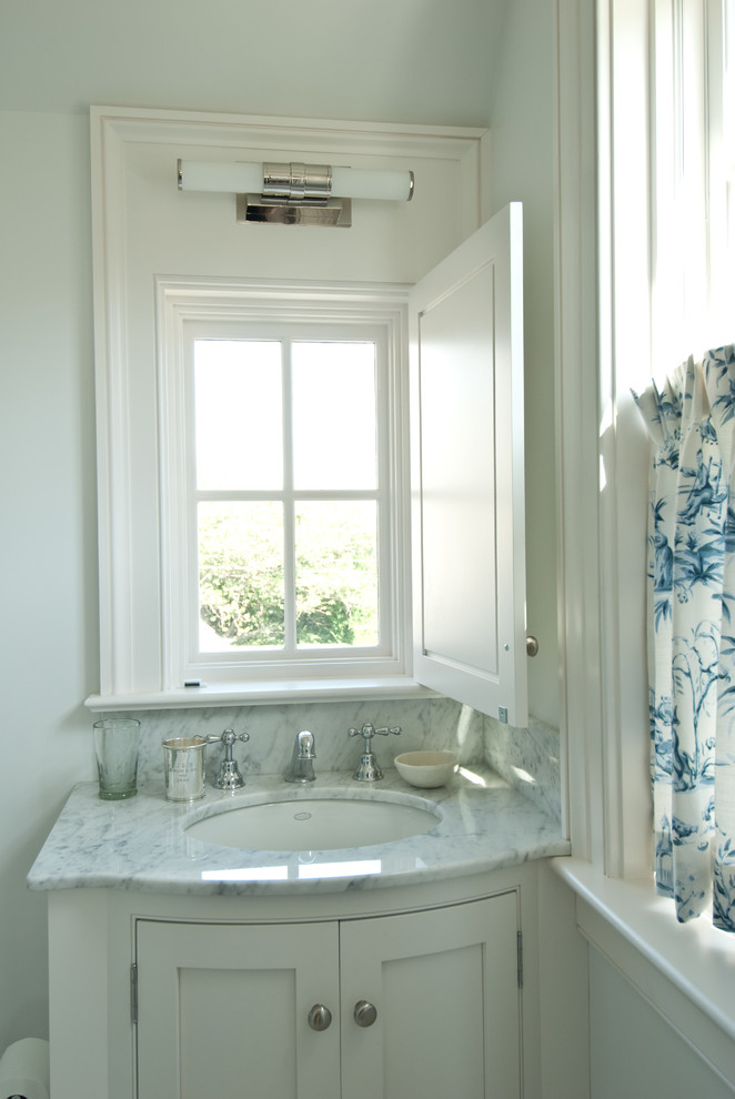 Beach style 3/4 white tile and ceramic tile bathroom photo in Providence with an undermount sink, shaker cabinets, white cabinets, marble countertops, a two-piece toilet and white walls