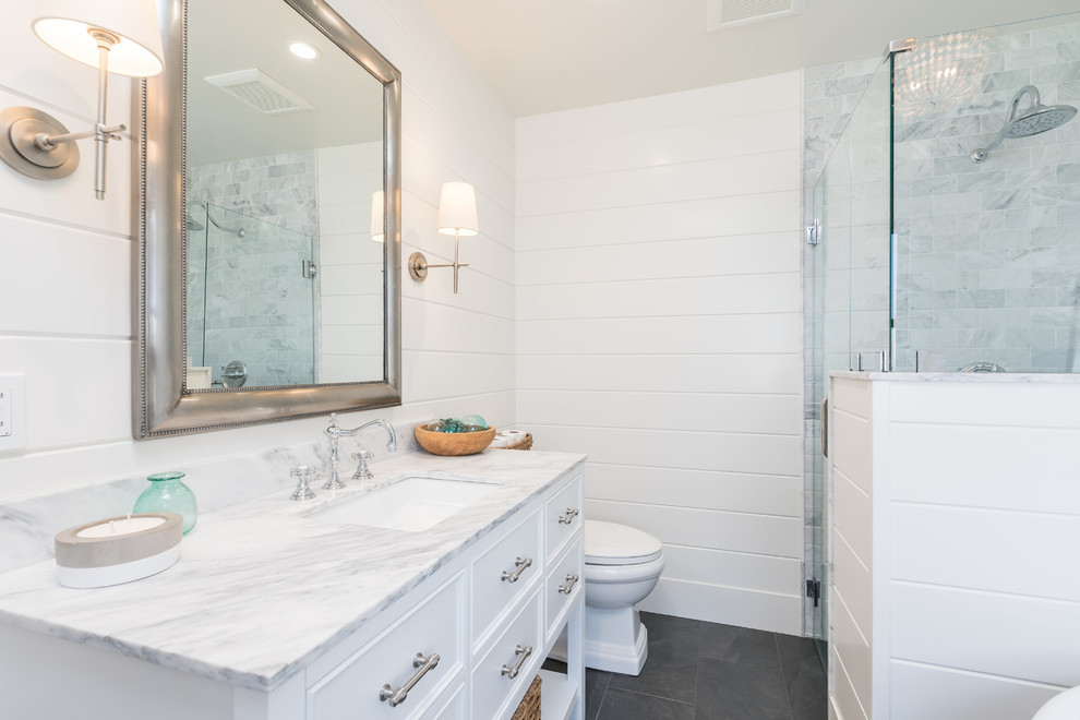 Mid-sized beach style master white tile bathroom photo in San Luis Obispo with recessed-panel cabinets, white cabinets, marble countertops and white countertops