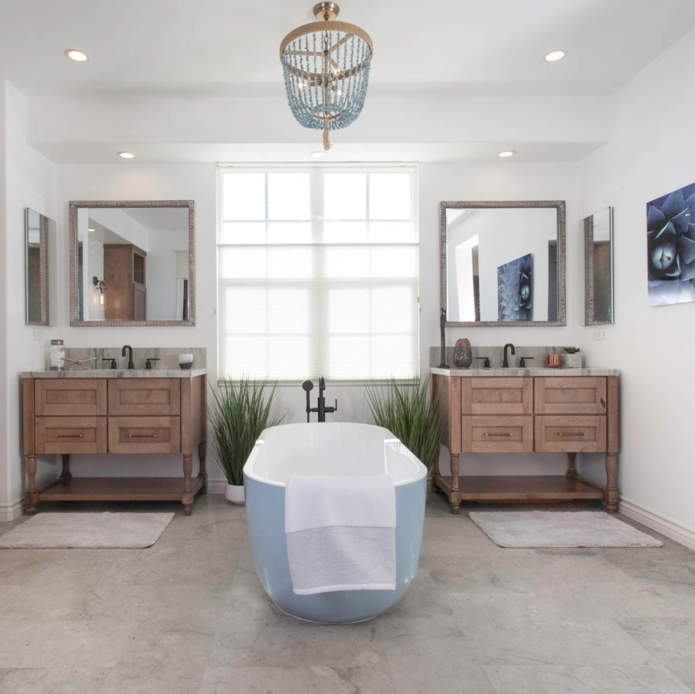 Photo of a large ensuite bathroom in San Diego with recessed-panel cabinets, distressed cabinets, a freestanding bath, a walk-in shower, a one-piece toilet, white tiles, white walls, limestone flooring, a submerged sink, quartz worktops, grey floors, a hinged door, grey worktops, a shower bench, double sinks, a built in vanity unit and wallpapered walls.