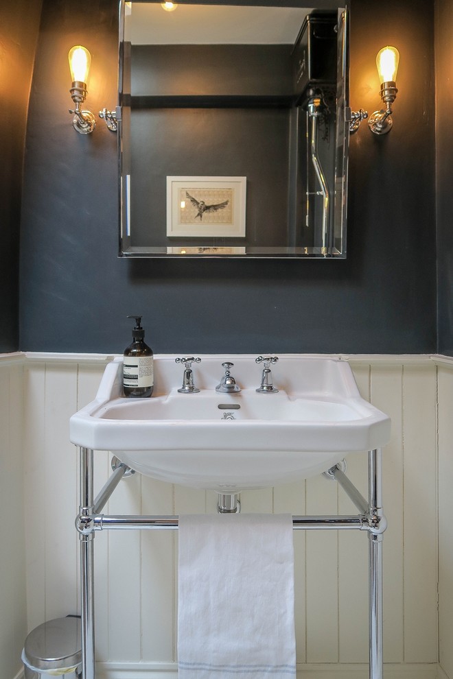 Inspiration for a large traditional family bathroom in London with a two-piece toilet, white tiles, grey walls, painted wood flooring, a console sink and white floors.