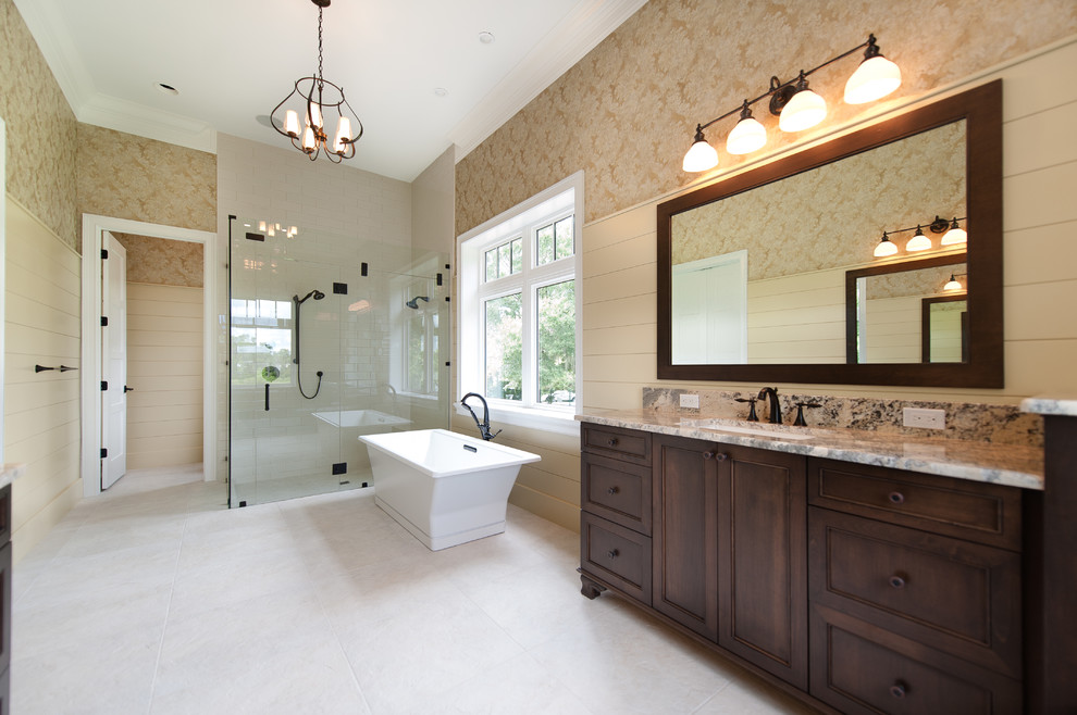 Bathroom - large coastal master ceramic tile and beige floor bathroom idea in Orlando with shaker cabinets, dark wood cabinets, beige walls, an undermount sink and a hinged shower door