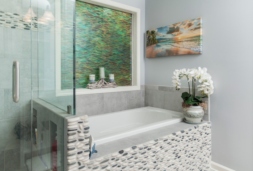 Example of a small beach style master porcelain tile and gray floor drop-in bathtub design in Atlanta with recessed-panel cabinets, blue walls, an undermount sink and granite countertops