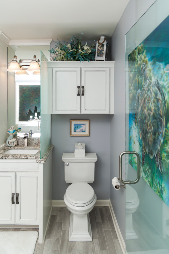 Inspiration for a small coastal master porcelain tile and gray floor drop-in bathtub remodel in Atlanta with recessed-panel cabinets, blue walls, an undermount sink and granite countertops