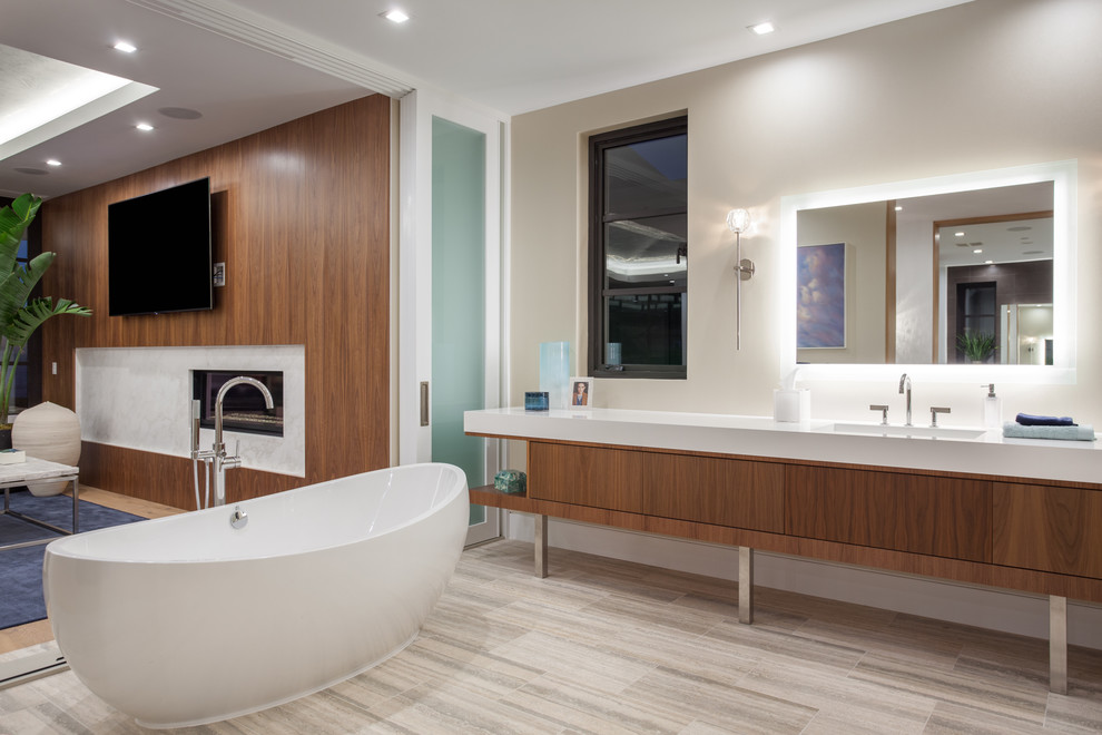Ispirazione per un'ampia stanza da bagno padronale contemporanea con ante lisce, ante in legno scuro, vasca freestanding, pareti bianche, lavabo integrato, top in quarzo composito, pavimento multicolore e top bianco