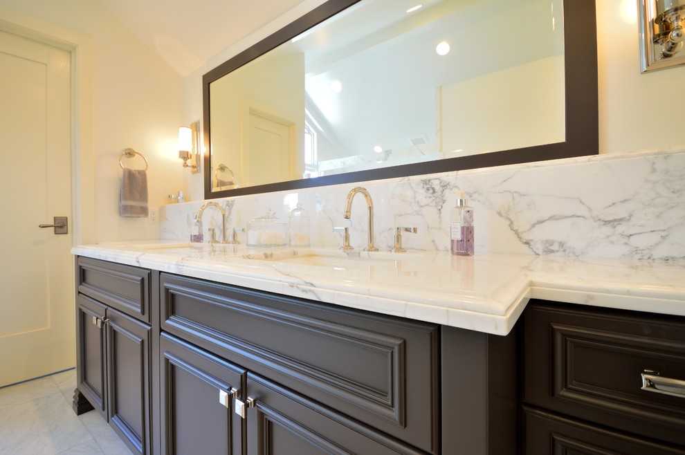 This is an example of a large classic ensuite bathroom in San Diego with a submerged sink, freestanding cabinets, grey cabinets, marble worktops, a submerged bath, an alcove shower, a two-piece toilet, white tiles, metro tiles, white walls and marble flooring.
