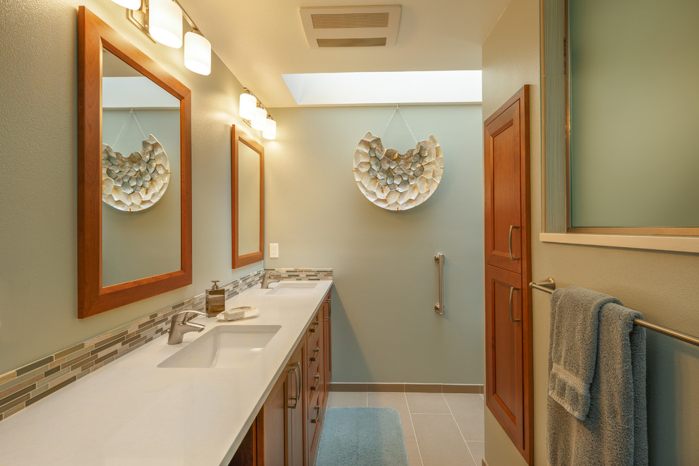 Bathroom - mid-sized coastal master multicolored tile and matchstick tile slate floor and gray floor bathroom idea in Seattle with recessed-panel cabinets, medium tone wood cabinets, a two-piece toilet, green walls, an undermount sink and quartzite countertops