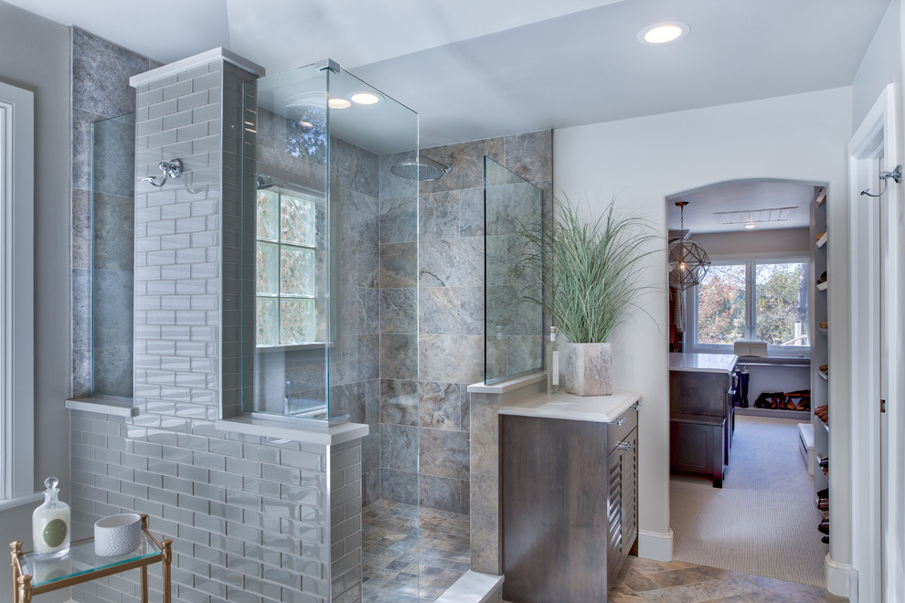 Example of a huge beach style master multicolored tile and glass tile ceramic tile bathroom design in Denver with louvered cabinets, medium tone wood cabinets, a two-piece toilet, beige walls, an undermount sink and quartz countertops