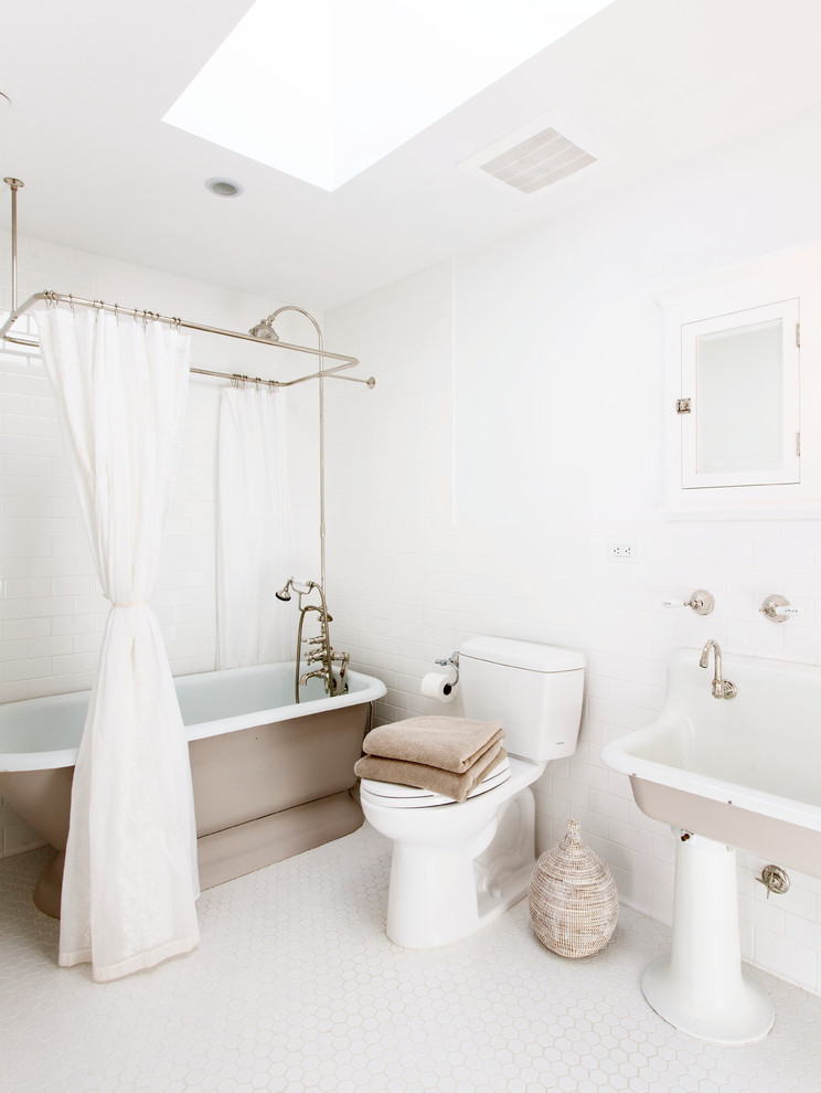 Design ideas for a large shabby-chic style bathroom in New York with a trough sink, flat-panel cabinets, a freestanding bath, a shower/bath combination, a two-piece toilet, white tiles, ceramic tiles, white walls and ceramic flooring.