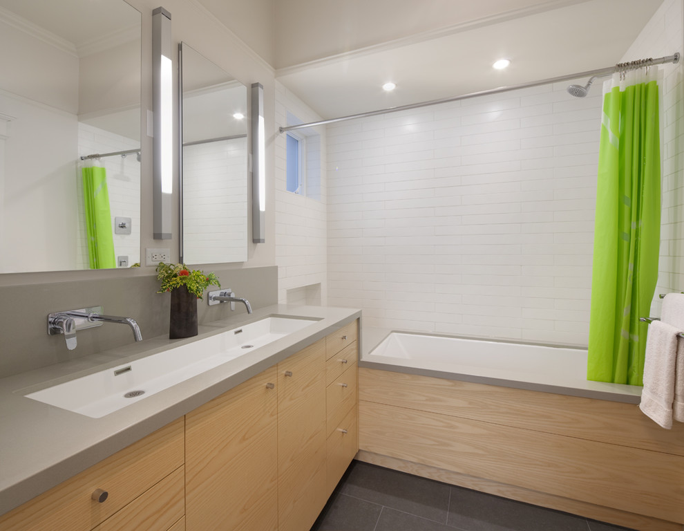 На фото: ванная комната в современном стиле с плиткой кабанчик и раковиной с несколькими смесителями с