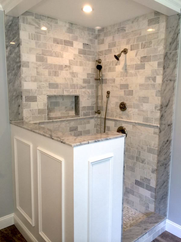 Example of a mid-sized classic master brown tile and subway tile porcelain tile doorless shower design in Philadelphia with an integrated sink, shaker cabinets, marble countertops, an undermount tub, a one-piece toilet and blue walls