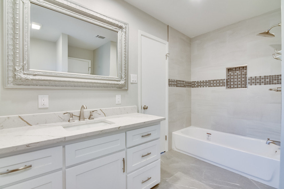 Design ideas for a medium sized traditional ensuite bathroom in Dallas with shaker cabinets, white cabinets, a built-in bath, an alcove shower, a two-piece toilet, ceramic tiles, grey walls, slate flooring, a submerged sink, engineered stone worktops, grey floors, a shower curtain, white worktops, double sinks and a built in vanity unit.
