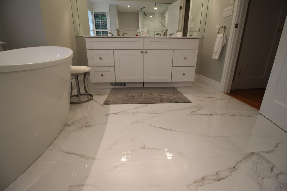 Large transitional master white tile and porcelain tile ceramic tile and white floor bathroom photo in Toronto with shaker cabinets, light wood cabinets, a one-piece toilet, gray walls, an undermount sink, quartz countertops and a hinged shower door