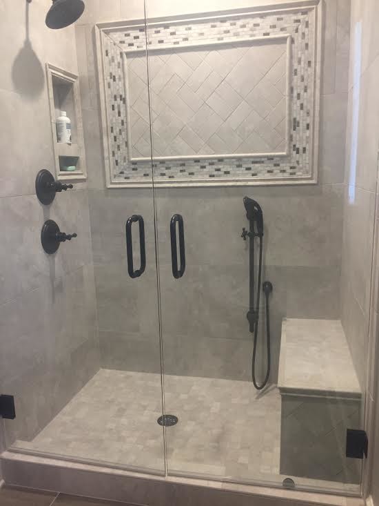 This is an example of a large traditional ensuite bathroom in Atlanta with open cabinets, an alcove shower, grey tiles, cement tiles, grey walls, cement flooring, beige floors and a hinged door.