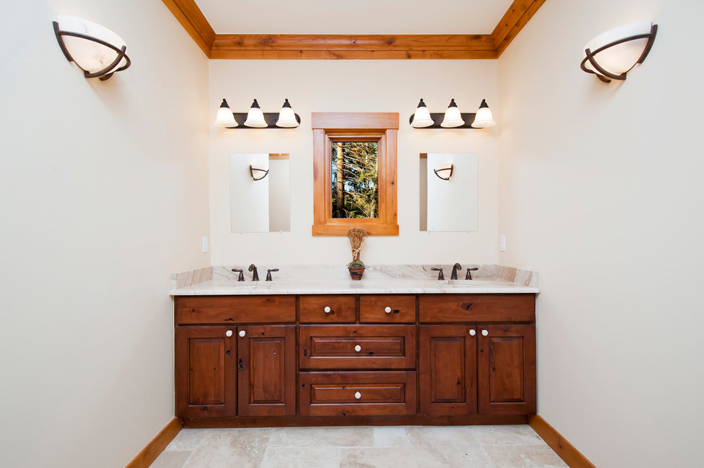 Bathroom - rustic master linoleum floor bathroom idea in Denver with an undermount sink, raised-panel cabinets, medium tone wood cabinets and beige walls