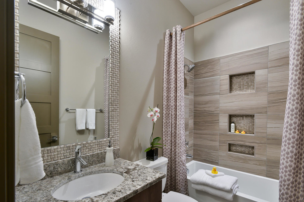 Mid-sized trendy kids' beige tile and ceramic tile bathroom photo in Denver with a two-piece toilet, beige walls, an undermount sink and granite countertops