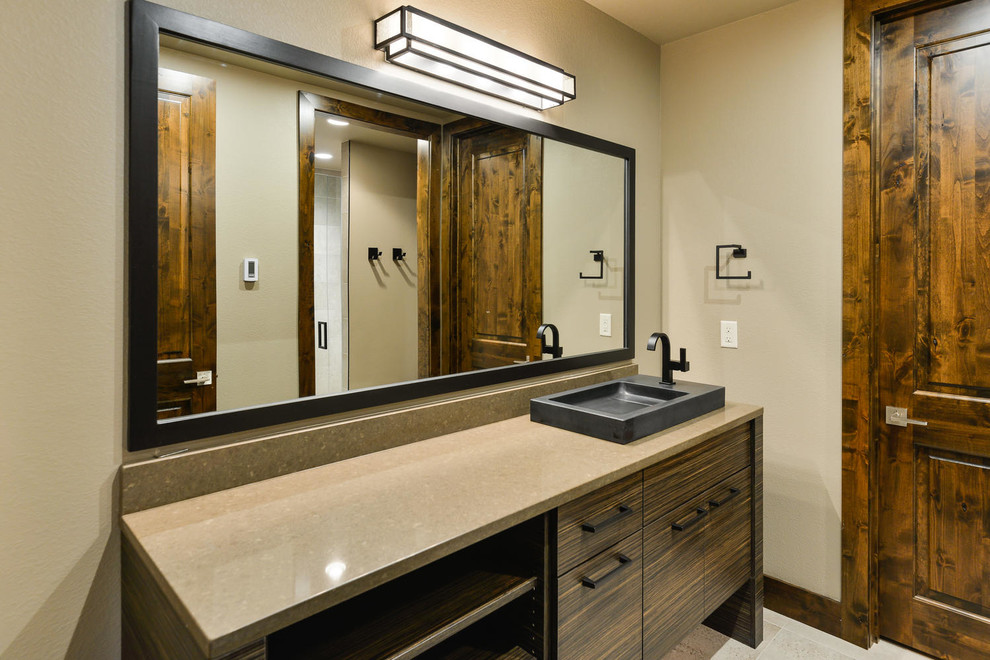 Design ideas for a medium sized contemporary shower room bathroom in Denver with flat-panel cabinets, dark wood cabinets, an alcove shower, beige walls, ceramic flooring, a built-in sink and engineered stone worktops.