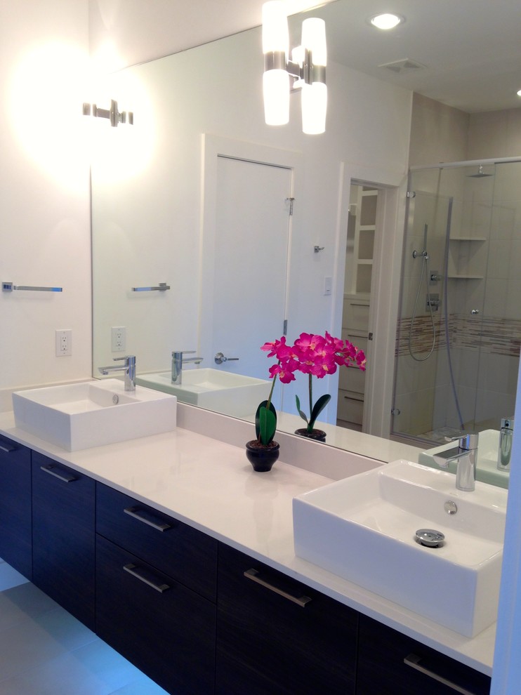 Example of a minimalist kids' white tile and porcelain tile porcelain tile bathroom design in Houston with a vessel sink, flat-panel cabinets, dark wood cabinets, quartz countertops and white walls