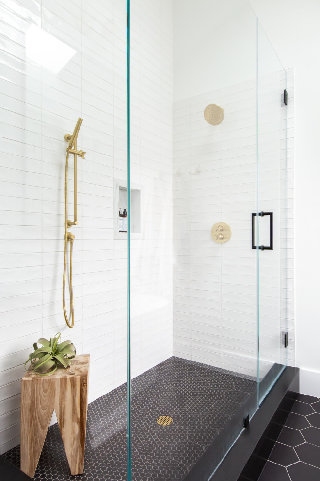 Photo of a contemporary bathroom in Atlanta with a corner shower, white tiles, metro tiles, white walls, black floors and a wall niche.