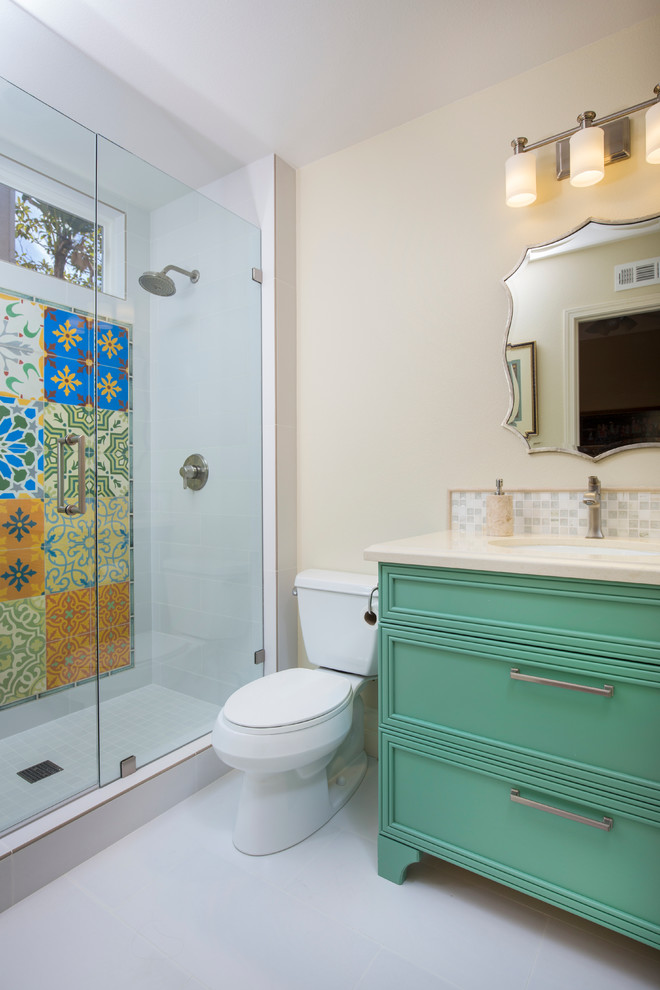 Medium sized mediterranean shower room bathroom in San Diego with recessed-panel cabinets, green cabinets, an alcove shower, a two-piece toilet, white tiles, porcelain tiles, beige walls, porcelain flooring, a submerged sink and engineered stone worktops.