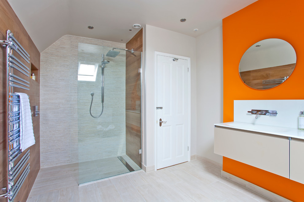 Example of a large trendy 3/4 beige tile and porcelain tile porcelain tile doorless shower design in Other with a wall-mount toilet and orange walls