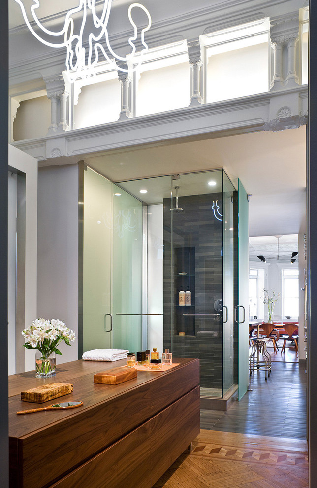Inspiration for a traditional bathroom in New York with flat-panel cabinets.