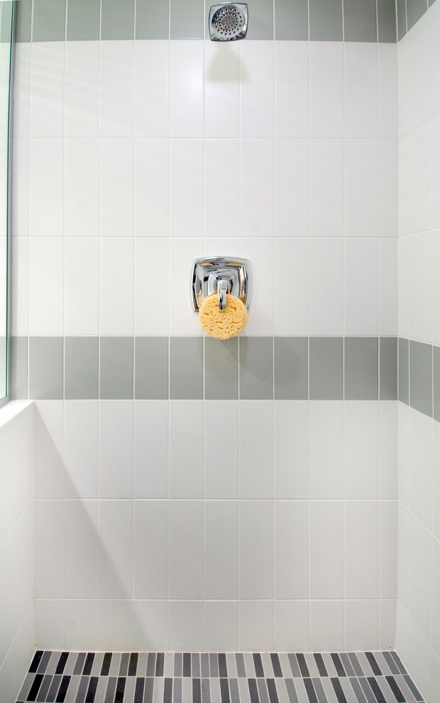 This is an example of a medium sized midcentury shower room bathroom in Columbus with flat-panel cabinets, medium wood cabinets, a double shower, a two-piece toilet, grey tiles, ceramic tiles, yellow walls, ceramic flooring, a submerged sink and engineered stone worktops.
