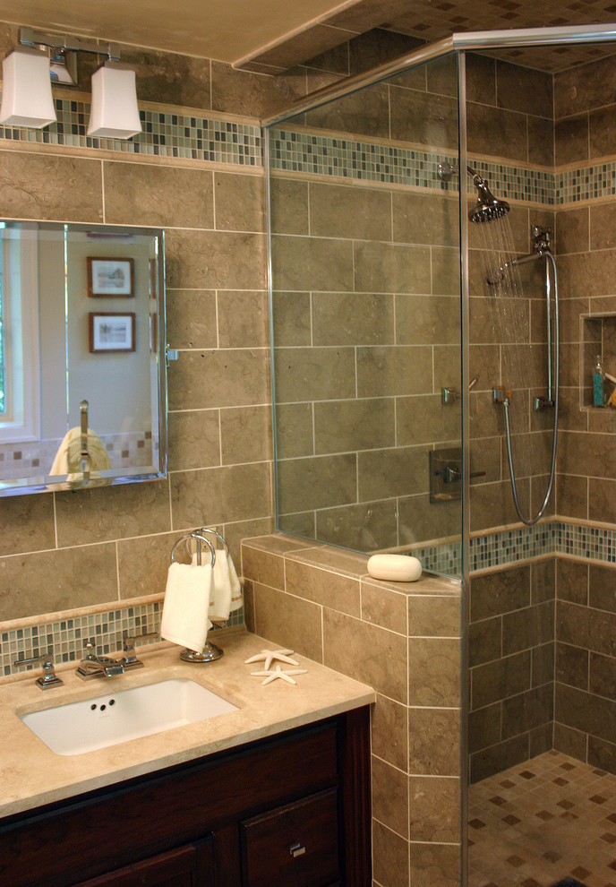 This is an example of a contemporary half tiled bathroom in Boston with mosaic tiles and a submerged sink.