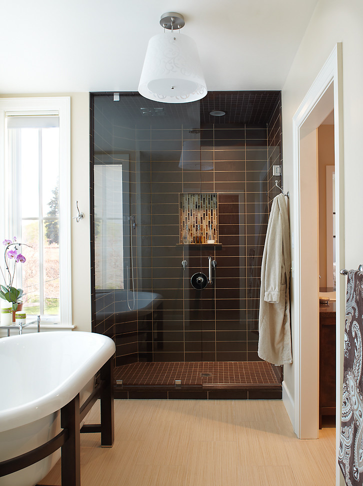 This is an example of a large contemporary ensuite bathroom in Denver with a freestanding bath, an alcove shower, black tiles, porcelain tiles, white walls and light hardwood flooring.