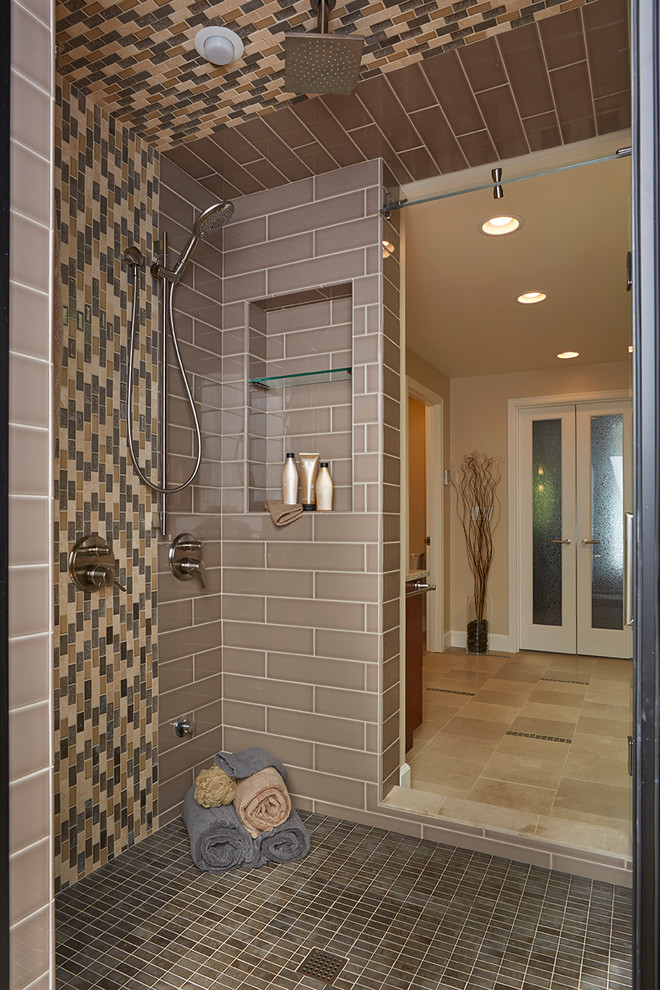 Example of a large trendy master beige tile and stone slab porcelain tile bathroom design in Seattle with an undermount sink, shaker cabinets, medium tone wood cabinets, granite countertops, a one-piece toilet and yellow walls