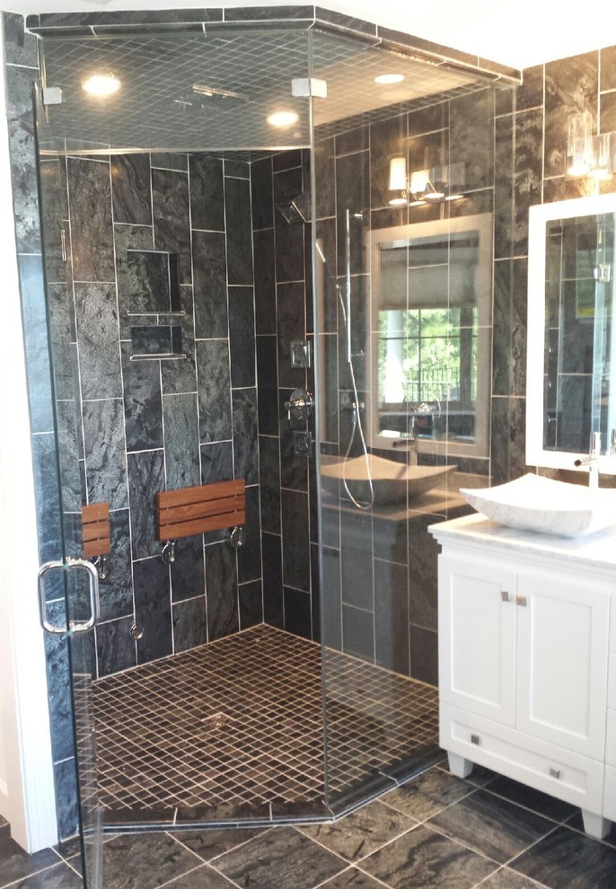 Bathroom - large contemporary master black tile and stone tile slate floor bathroom idea in Other with a vessel sink, shaker cabinets, white cabinets, marble countertops, a two-piece toilet and white walls