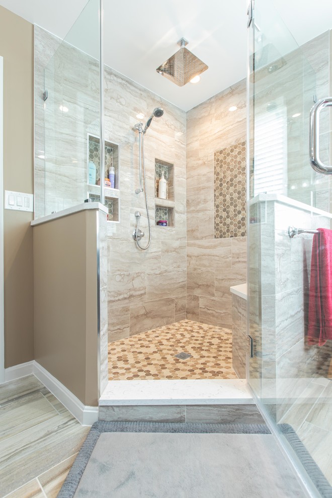 This is an example of a large modern ensuite bathroom in DC Metro with shaker cabinets, dark wood cabinets, a freestanding bath, a corner shower, a two-piece toilet, beige tiles, porcelain tiles, beige walls, porcelain flooring, a submerged sink, engineered stone worktops, beige floors, a hinged door and white worktops.