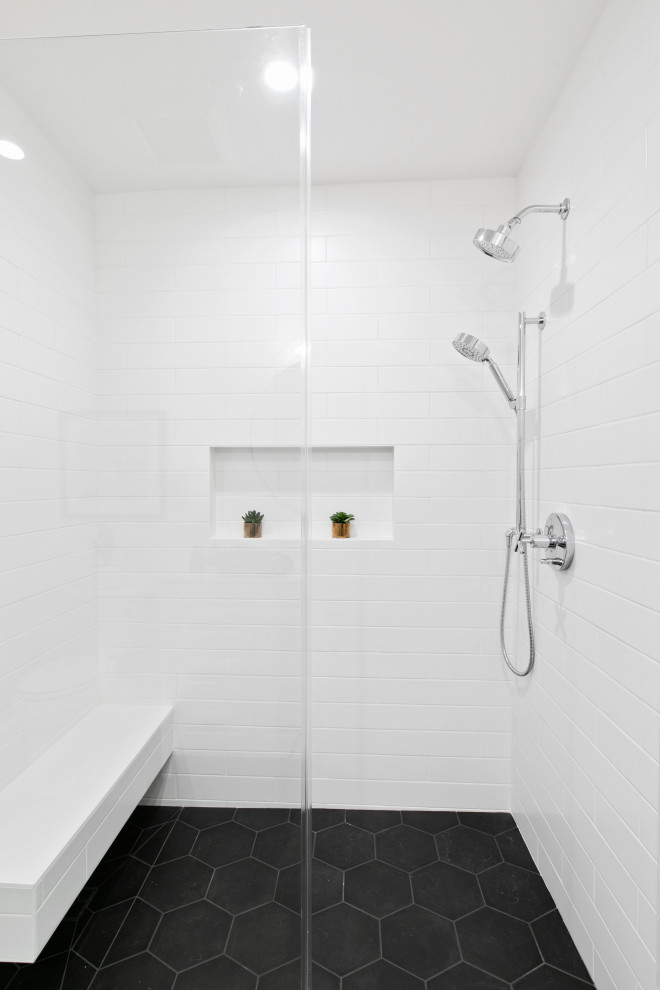 Inspiration for a large traditional bathroom in Los Angeles with shaker cabinets, white cabinets, white tiles, metro tiles, white walls, porcelain flooring, granite worktops, black floors and white worktops.