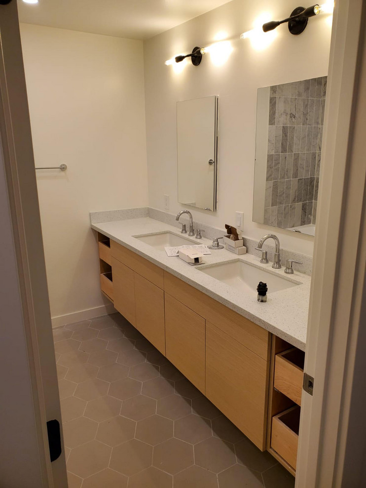 Small minimalist master gray tile and porcelain tile ceramic tile and multicolored floor bathroom photo in San Francisco with flat-panel cabinets, white cabinets, a two-piece toilet, white walls, an undermount sink, quartz countertops and multicolored countertops