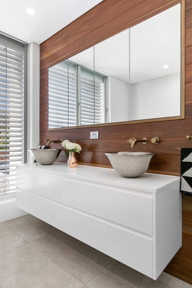 Photo of a large contemporary ensuite bathroom in Sydney with flat-panel cabinets, white cabinets, white walls, porcelain flooring, a console sink, grey floors and white worktops.