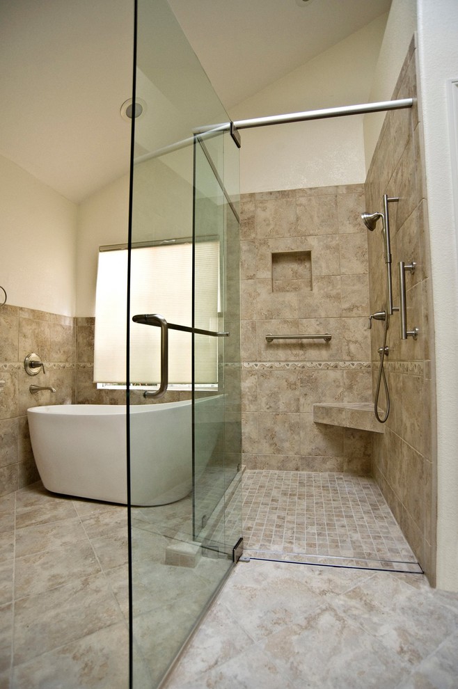 Photo of a medium sized traditional ensuite wet room bathroom in San Diego with a freestanding bath, beige tiles, travertine tiles, beige walls, travertine flooring, beige floors and a hinged door.