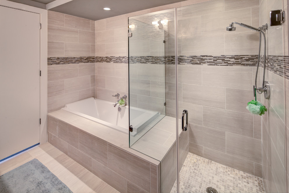 This is an example of a medium sized contemporary ensuite bathroom in Austin with flat-panel cabinets, medium wood cabinets, marble worktops, a built-in bath, a corner shower, white tiles, glass tiles, grey walls and ceramic flooring.