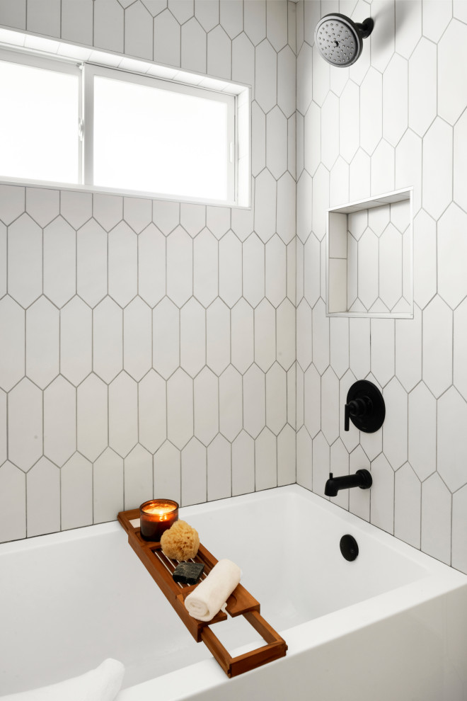 Mid-sized 1950s 3/4 white tile and ceramic tile double-sink bathroom photo in Minneapolis with flat-panel cabinets, light wood cabinets and a niche