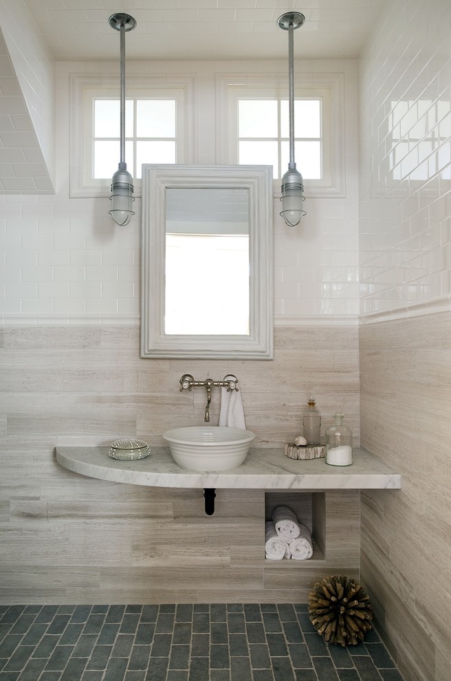 Example of a beach style beige tile bathroom design in Boston with a vessel sink and gray countertops
