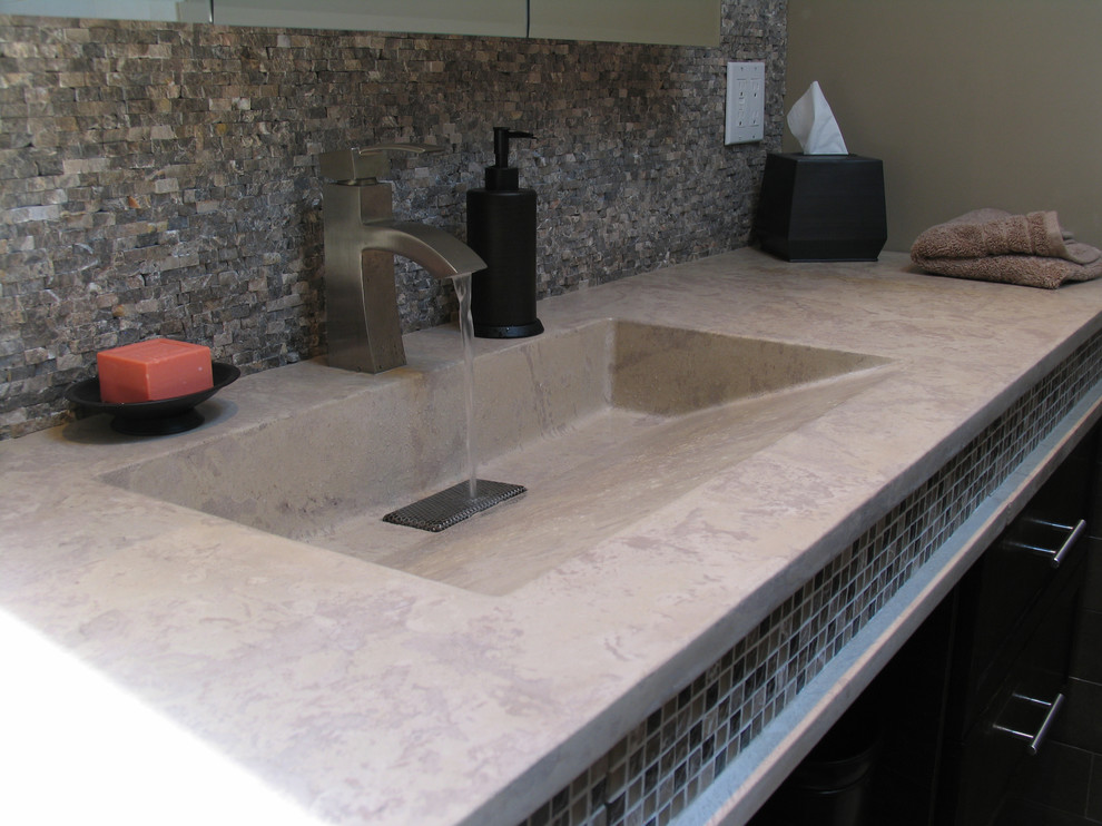 Bathroom - contemporary bathroom idea in Charlotte with an integrated sink and concrete countertops