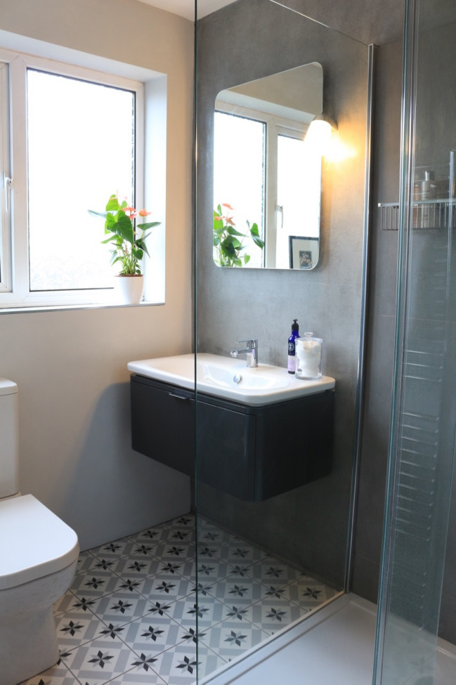 Example of a mid-century modern bathroom design in Other with a floating vanity